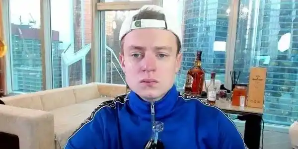 Mellstroy net worth – standing near skyscraper window in branded jacket